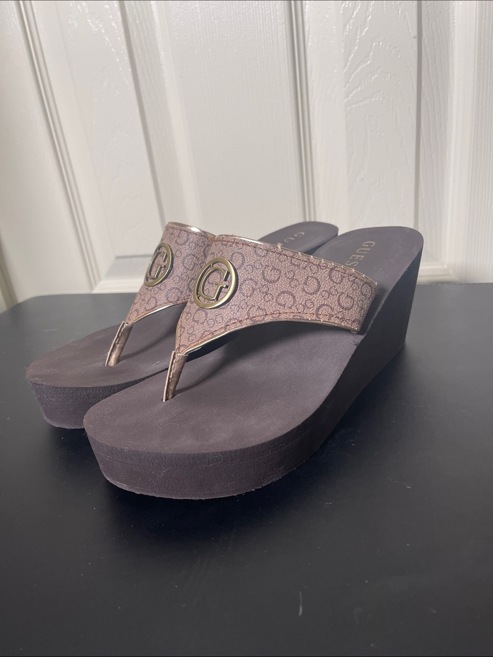 GUESS Brown Monogram Wedge Thong Sandals with Gold Medallion